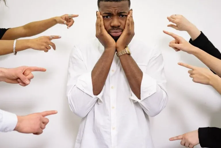 man with everyone pointing