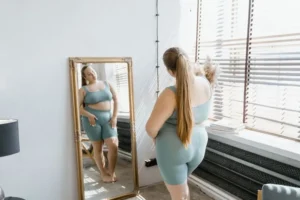 woman looking in the mirror