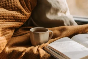 blanket coffee and book