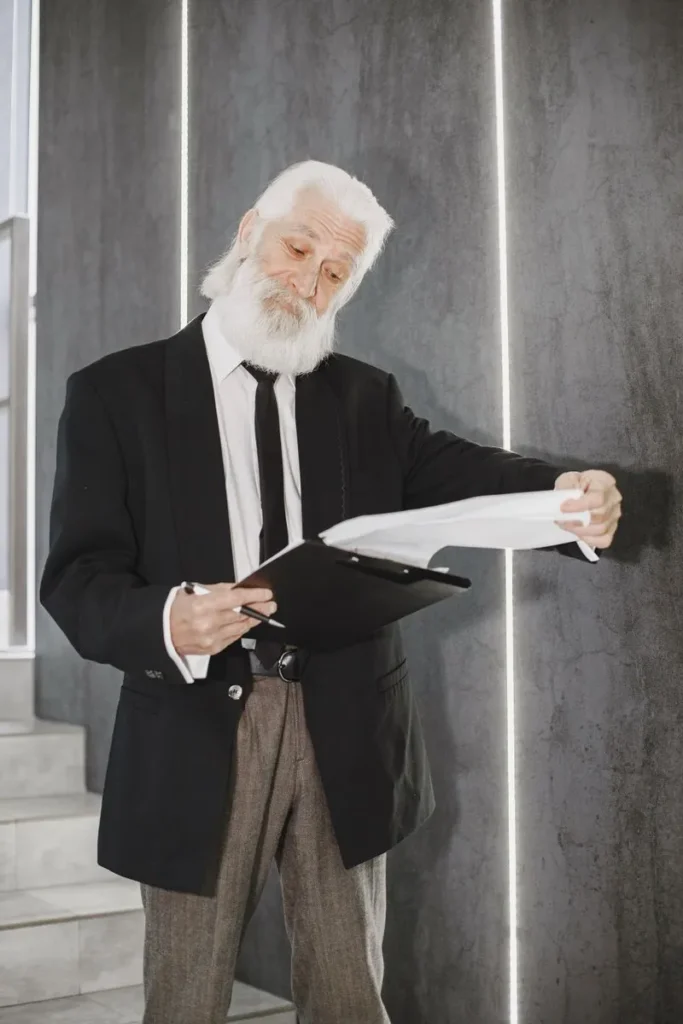man with clipboard looking like expert