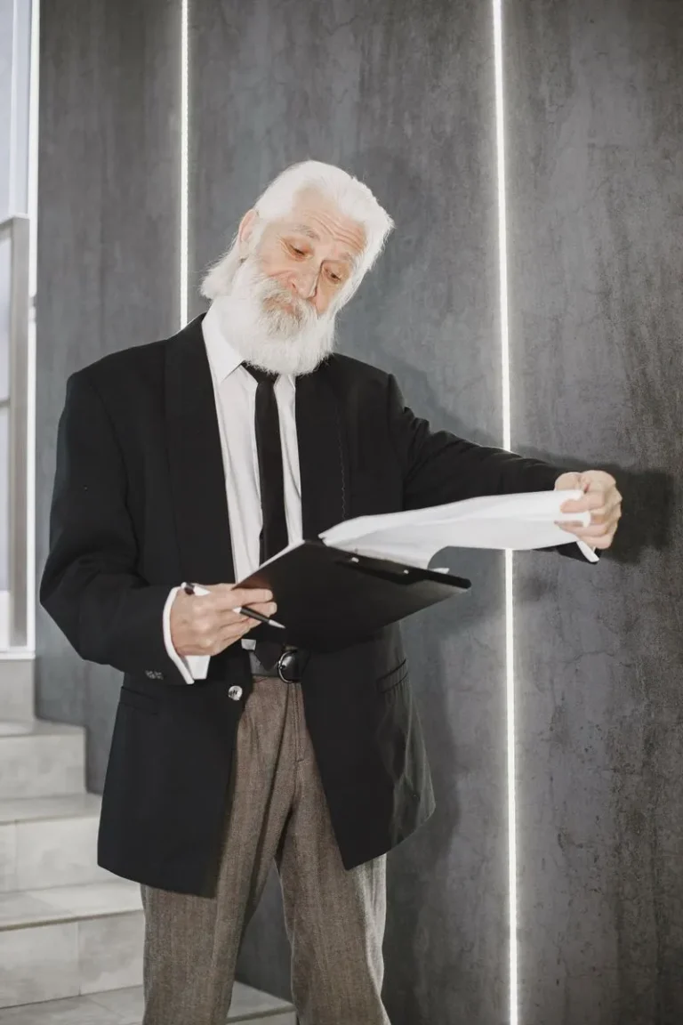 man with clipboard looking like expert