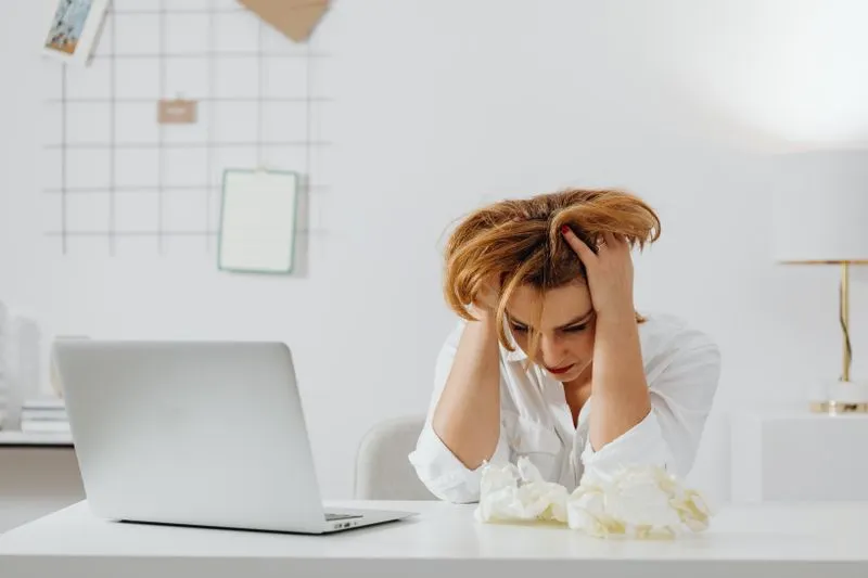 woman frustrated at desk
