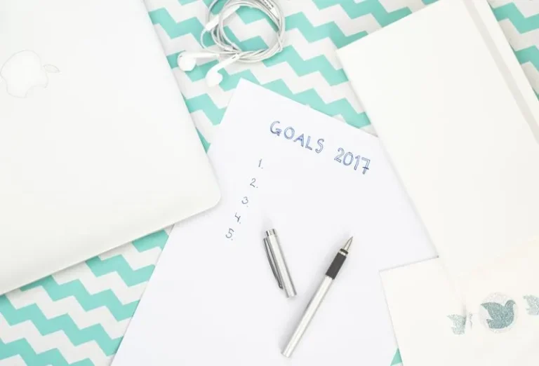 desk flatlay with 2017 goals sheet