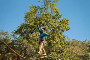 person walking on tightrope