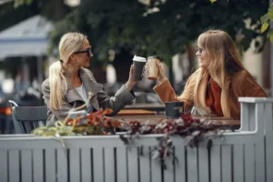 two friends having coffee together