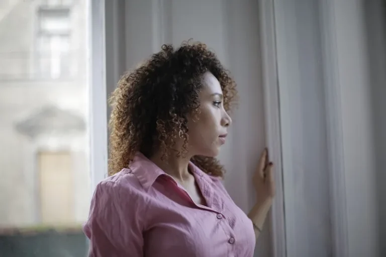 woman looking out of window