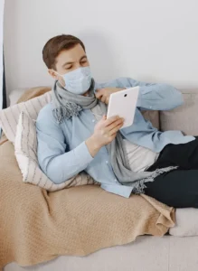 man on sofa in mask