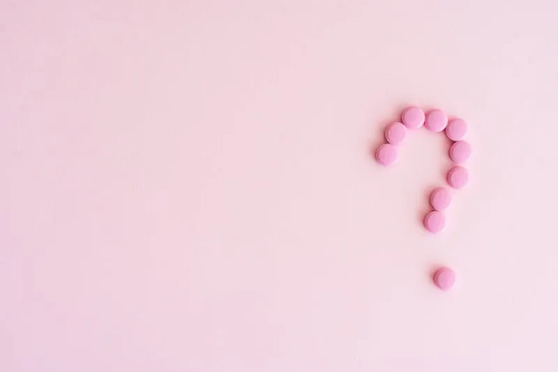 pink question mark made from pills