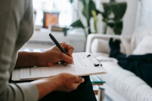woman filling out clipboard form
