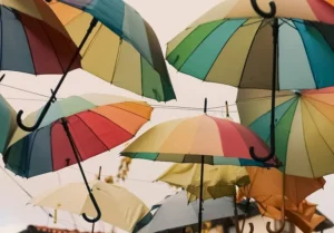 rainbow umbrellas above street