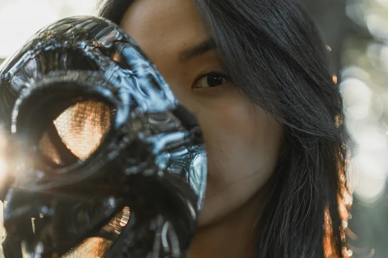 woman holding mask