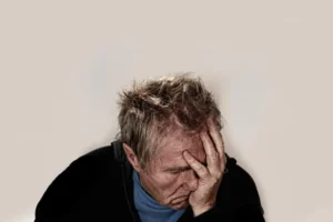man with head in hand