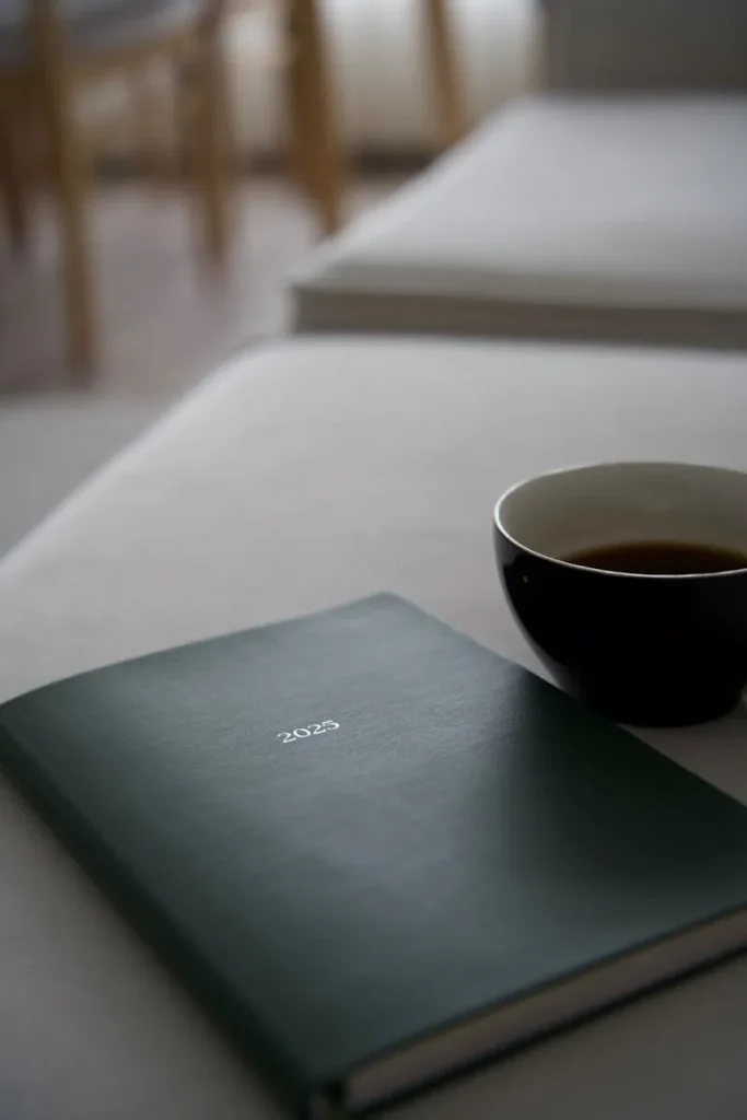 2023 planner on desk with coffee