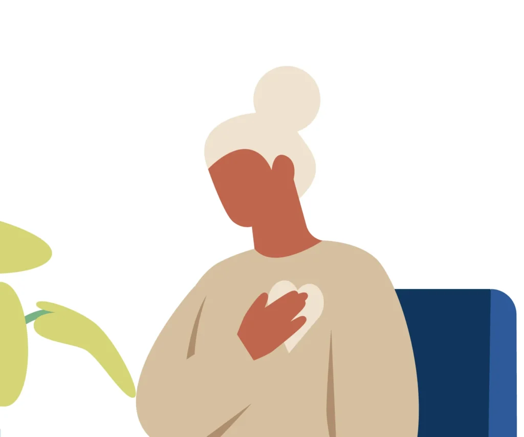 woman sitting in therapist chair with hand over heart